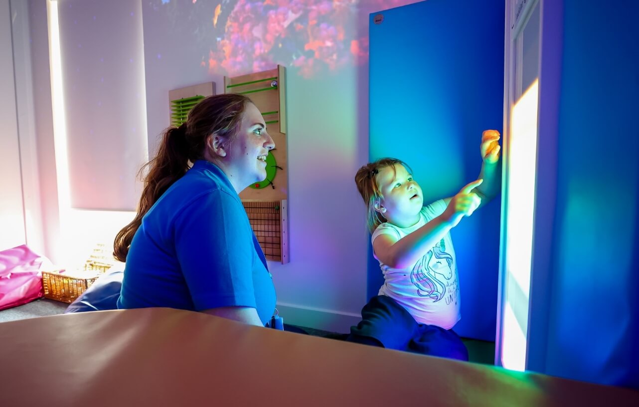 A nursery care worker and child from Strathisla Children's Centre,