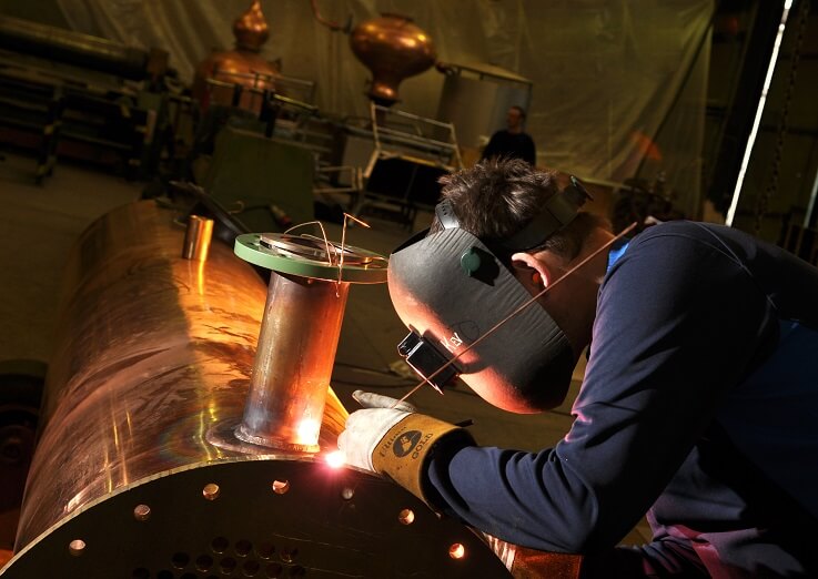 A photo showing an engineer at Forsyths welding