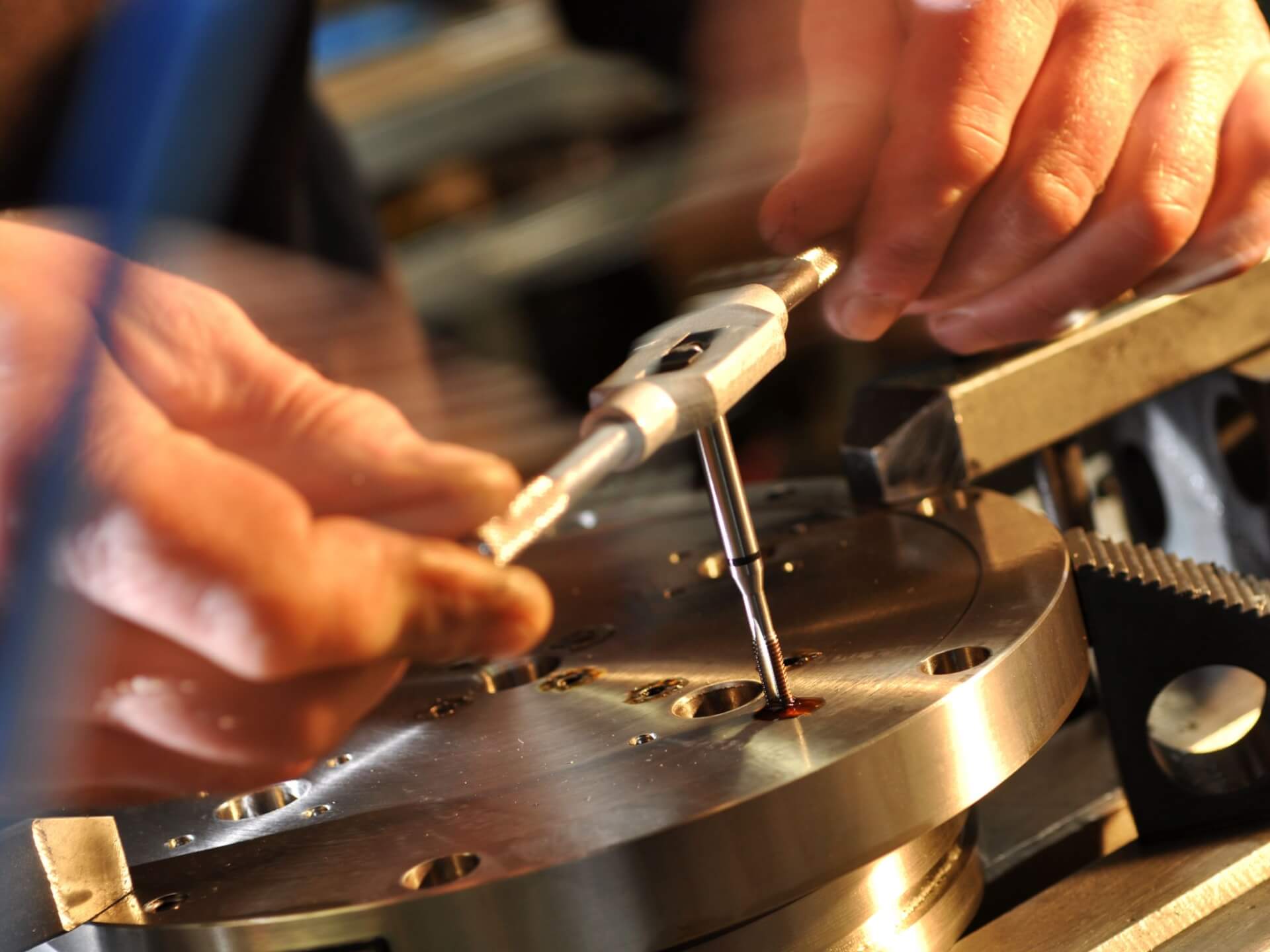 A close up of a skilled engineer working on machinery